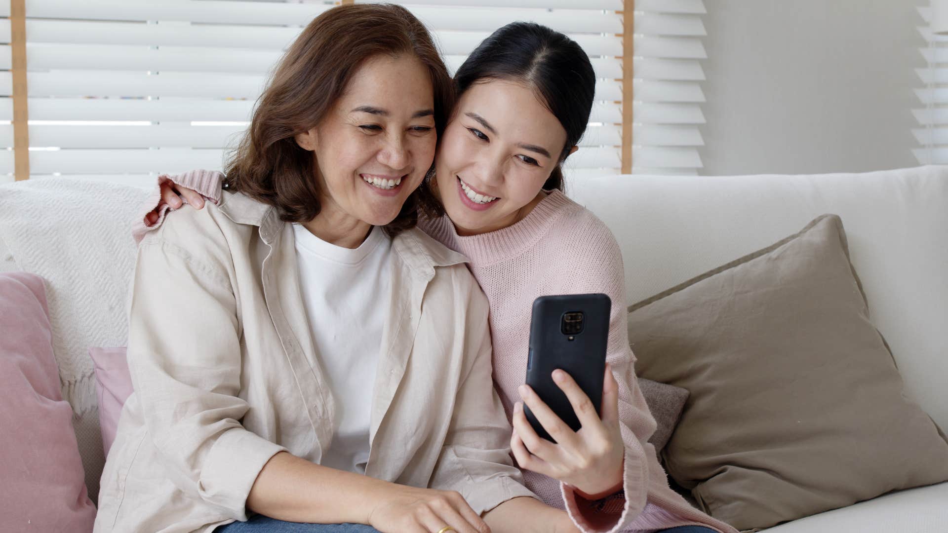 woman smiling and recording her mother's voice