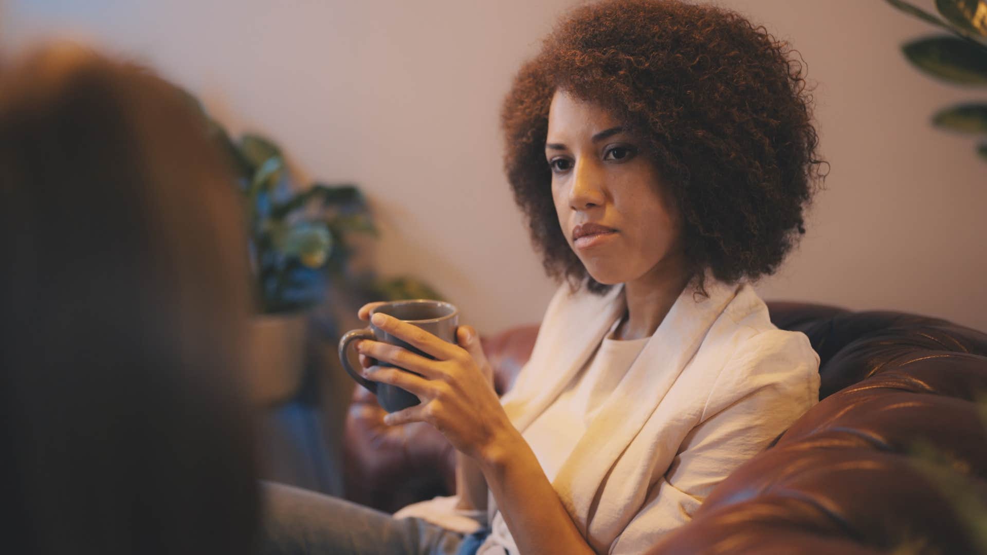 woman sharing past struggles and trauma with a friend