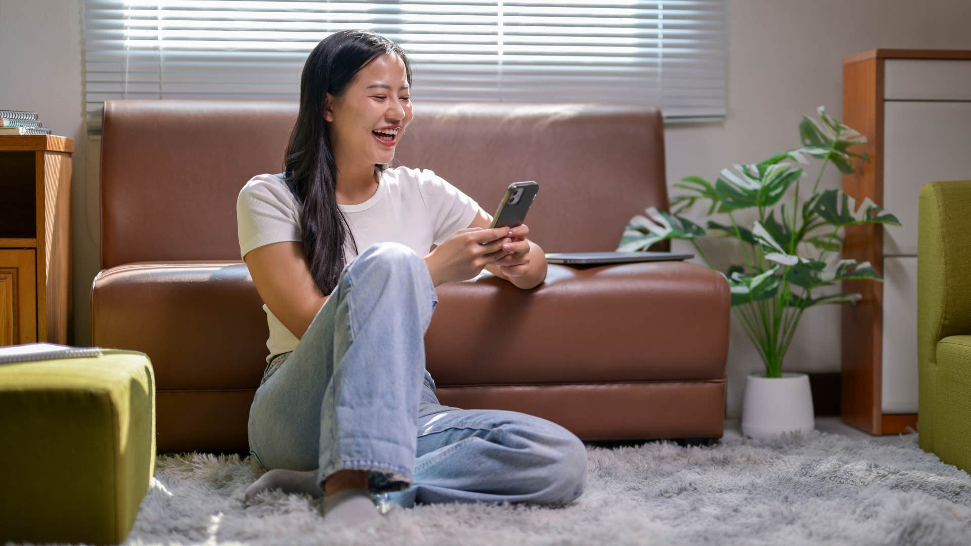 introverted woman sitting on the floor at home