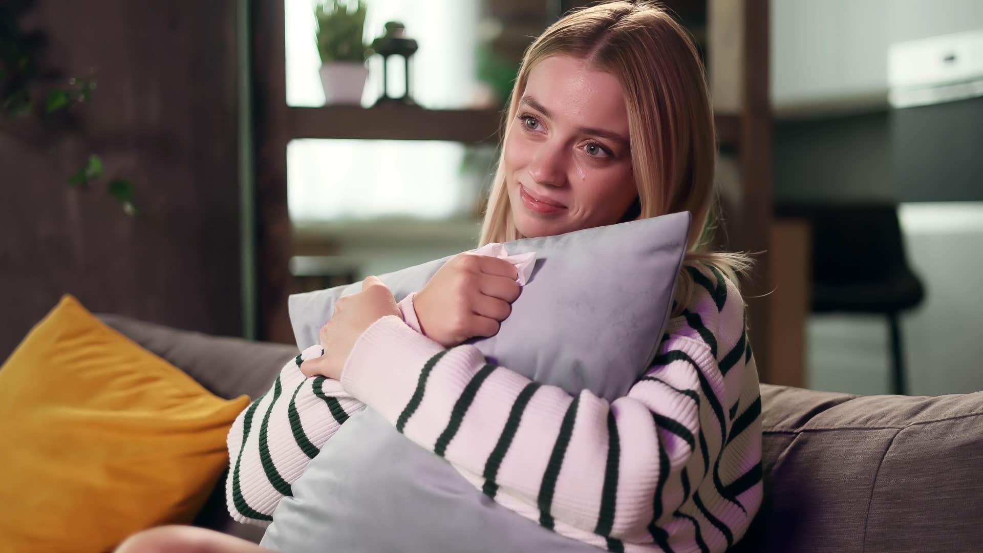 woman watching the same comfort shows at home