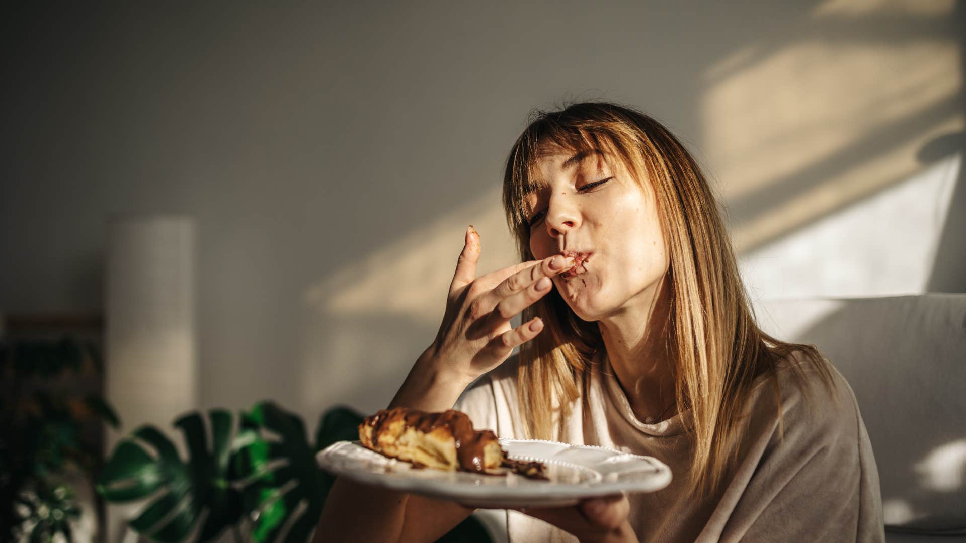 woman eating food at home