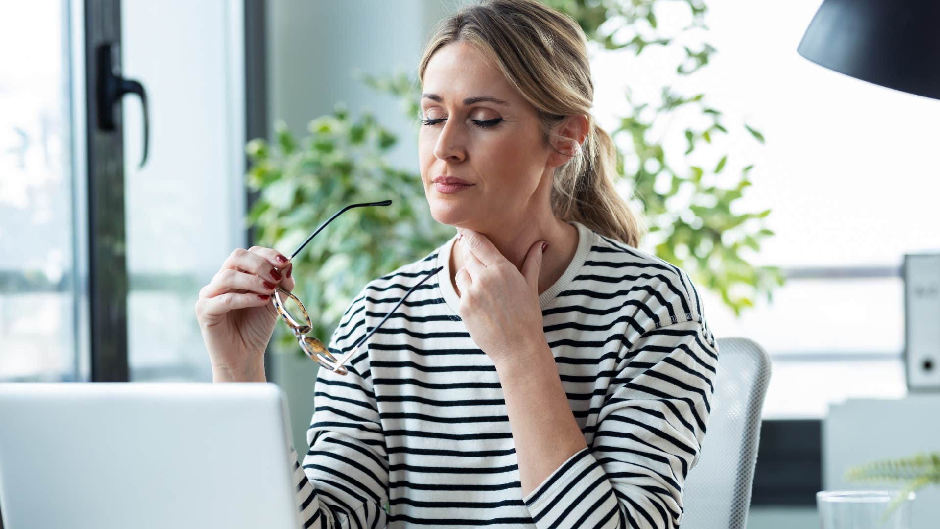 woman constantly fidgeting at her work desk