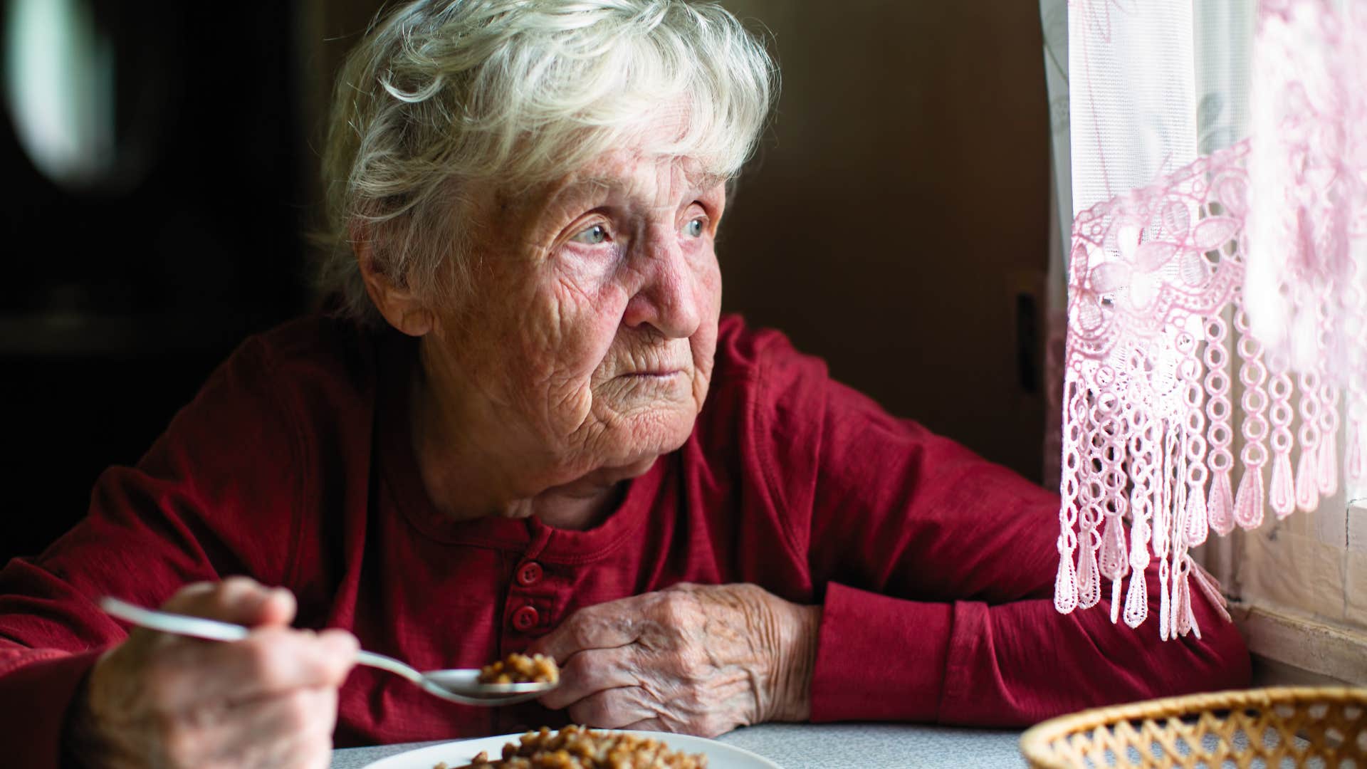 woman eating a meal with no fresh ingredients