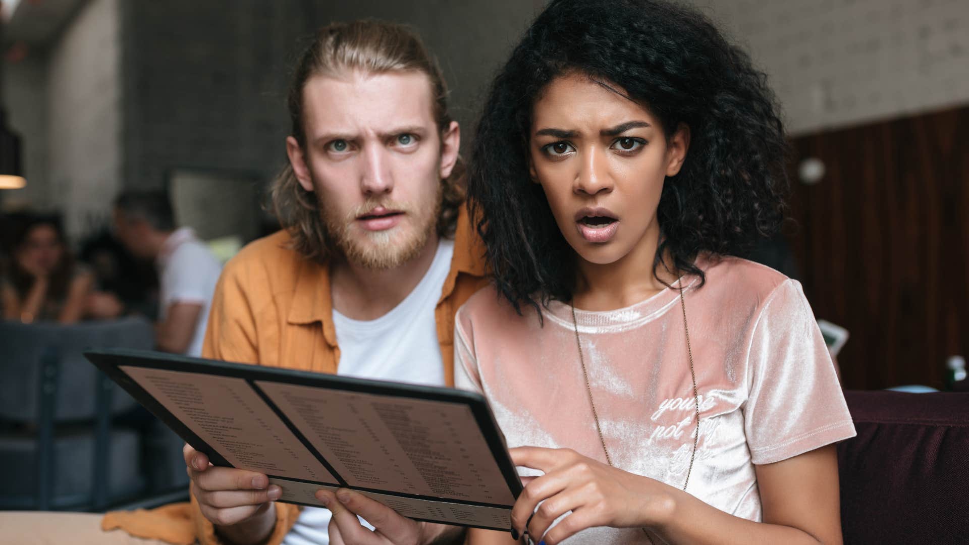 man intervening in the face of disrespect with his partner
