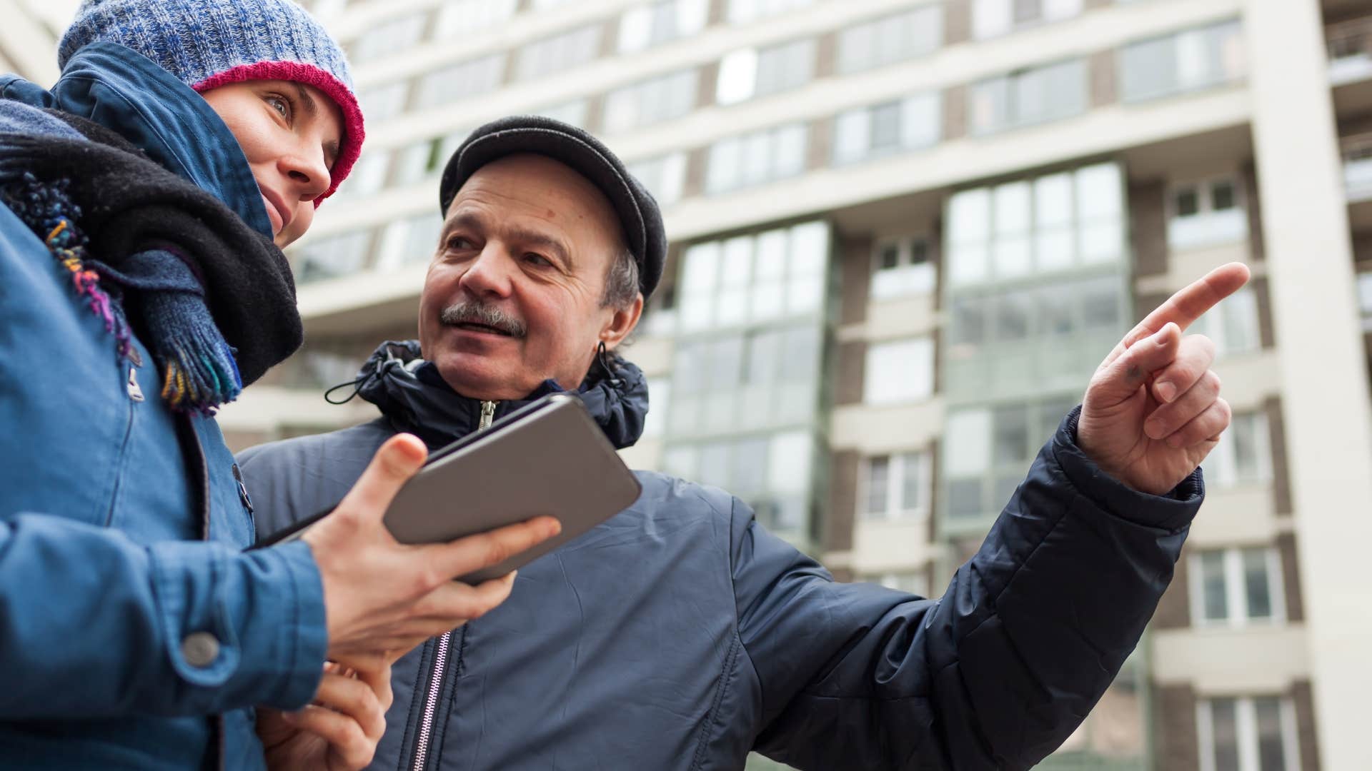 man stopping to help stranger on the street