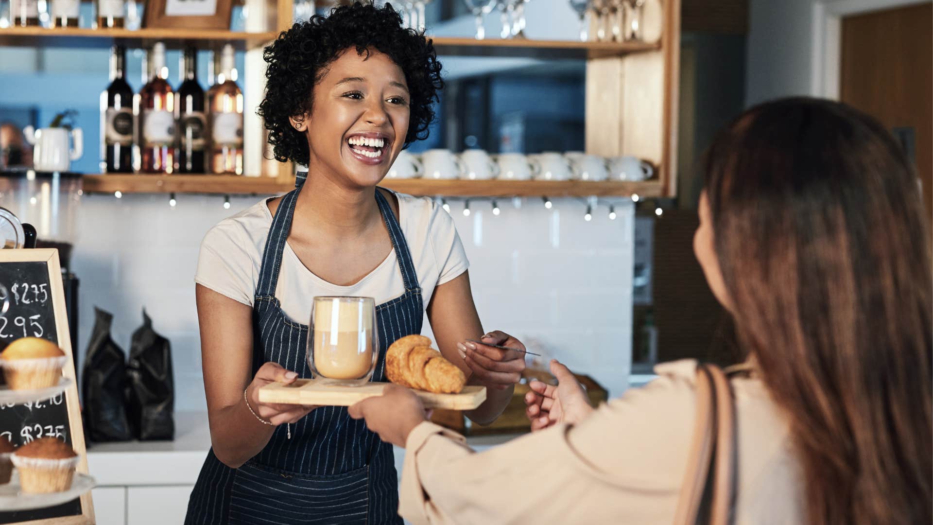 woman smiling and being kind to service worker