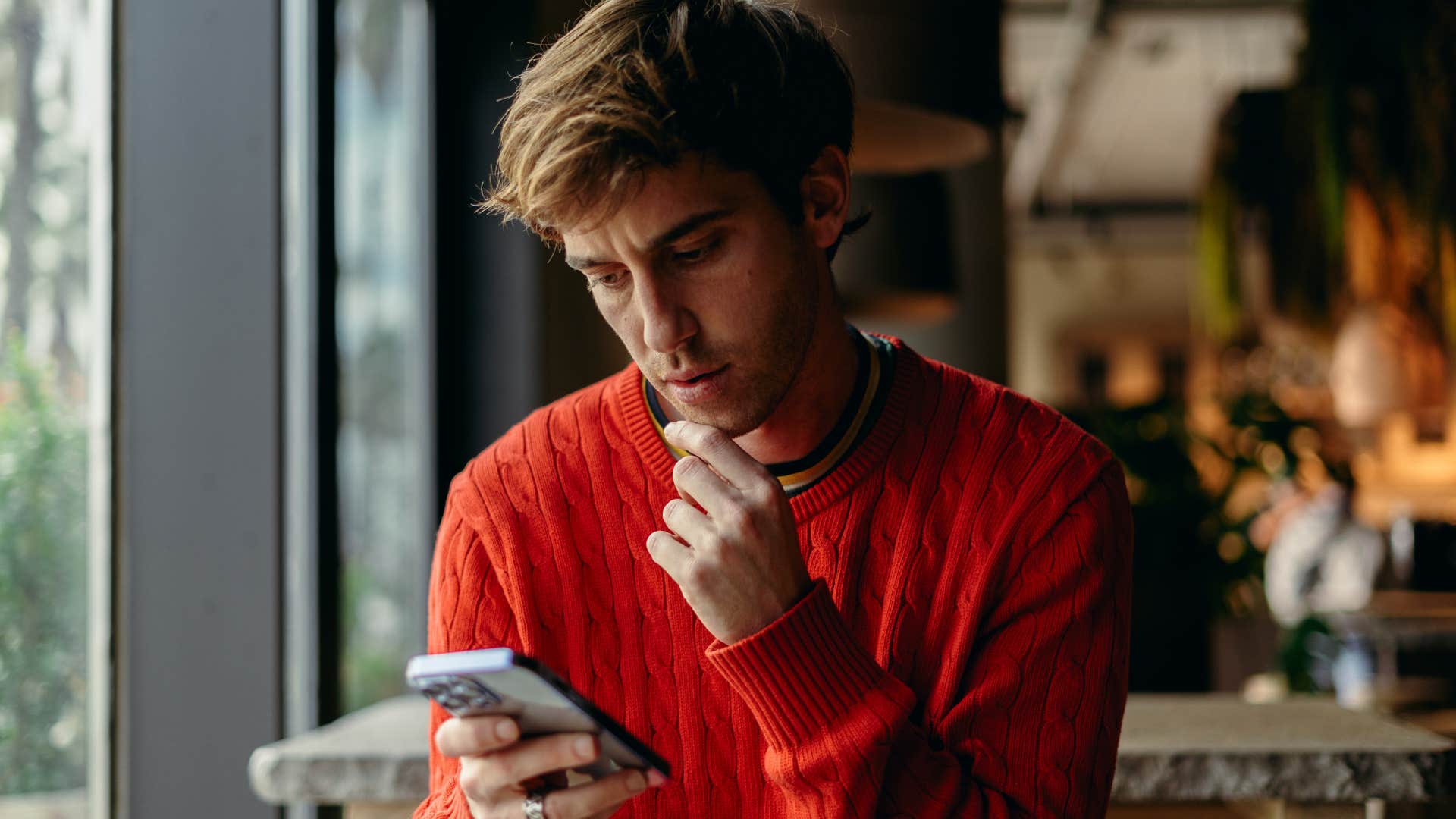 man texting with someone who doesn't match his energy