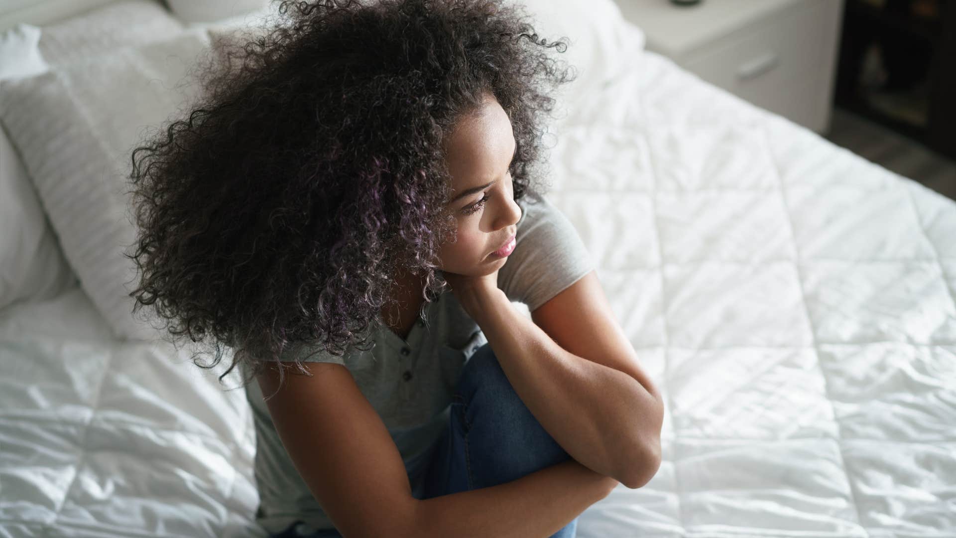 Woman sitting and not cuddling before bed.