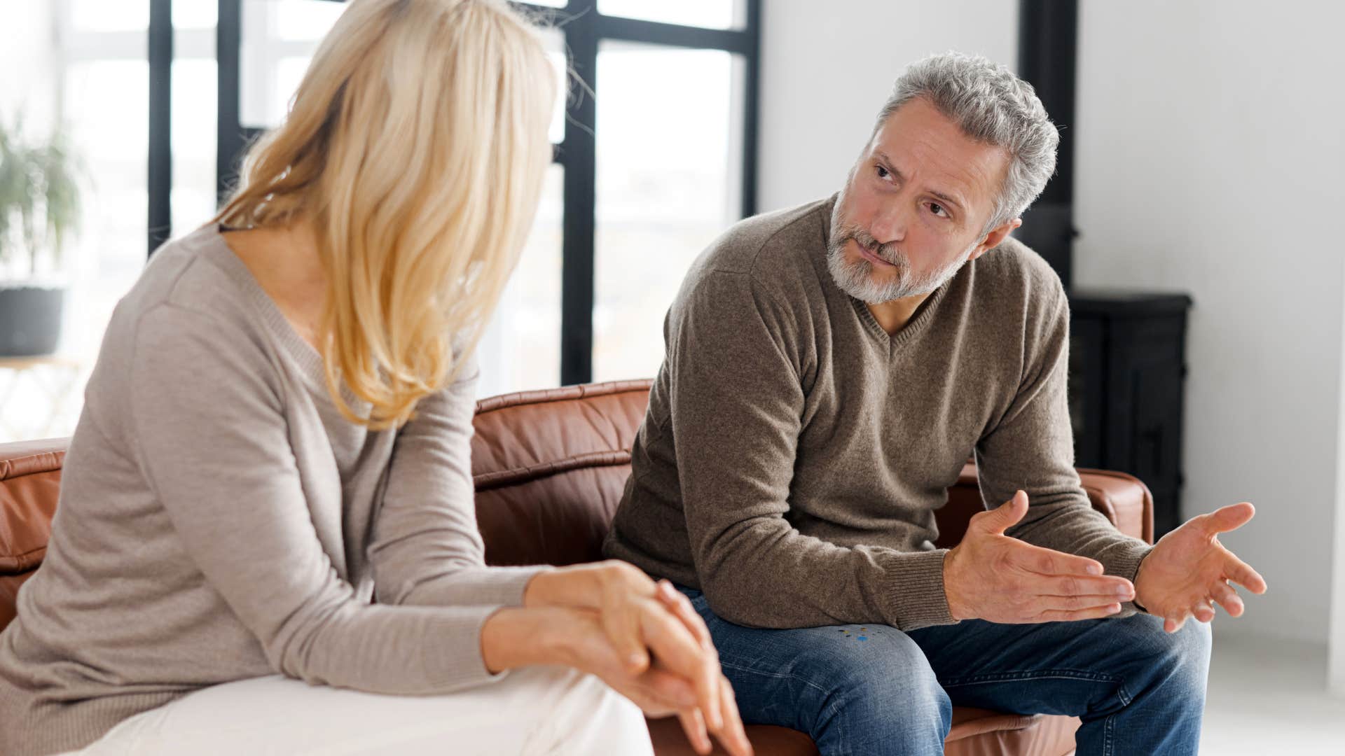 Man saying "Why can't you be more like her?" to his wife.