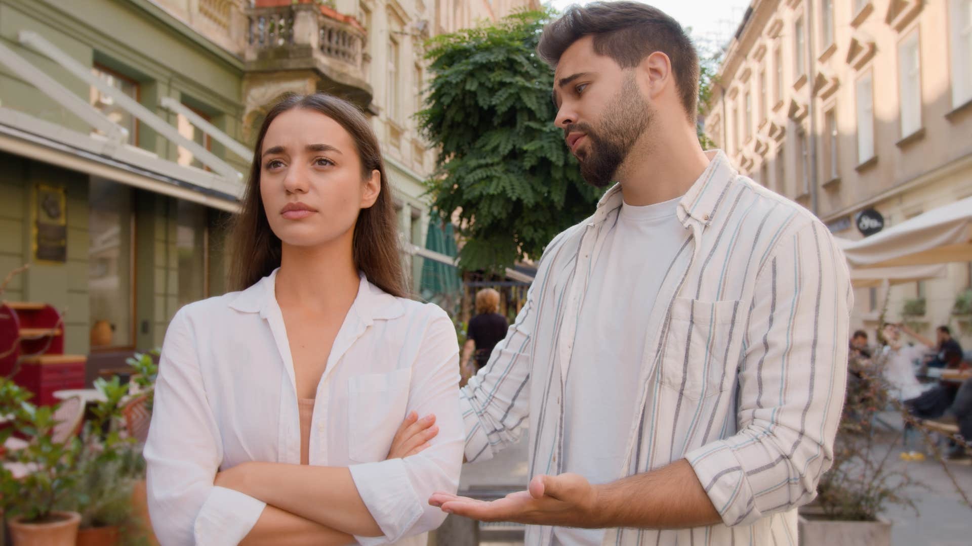 Man saying "I'm never enough for you" to his wife.