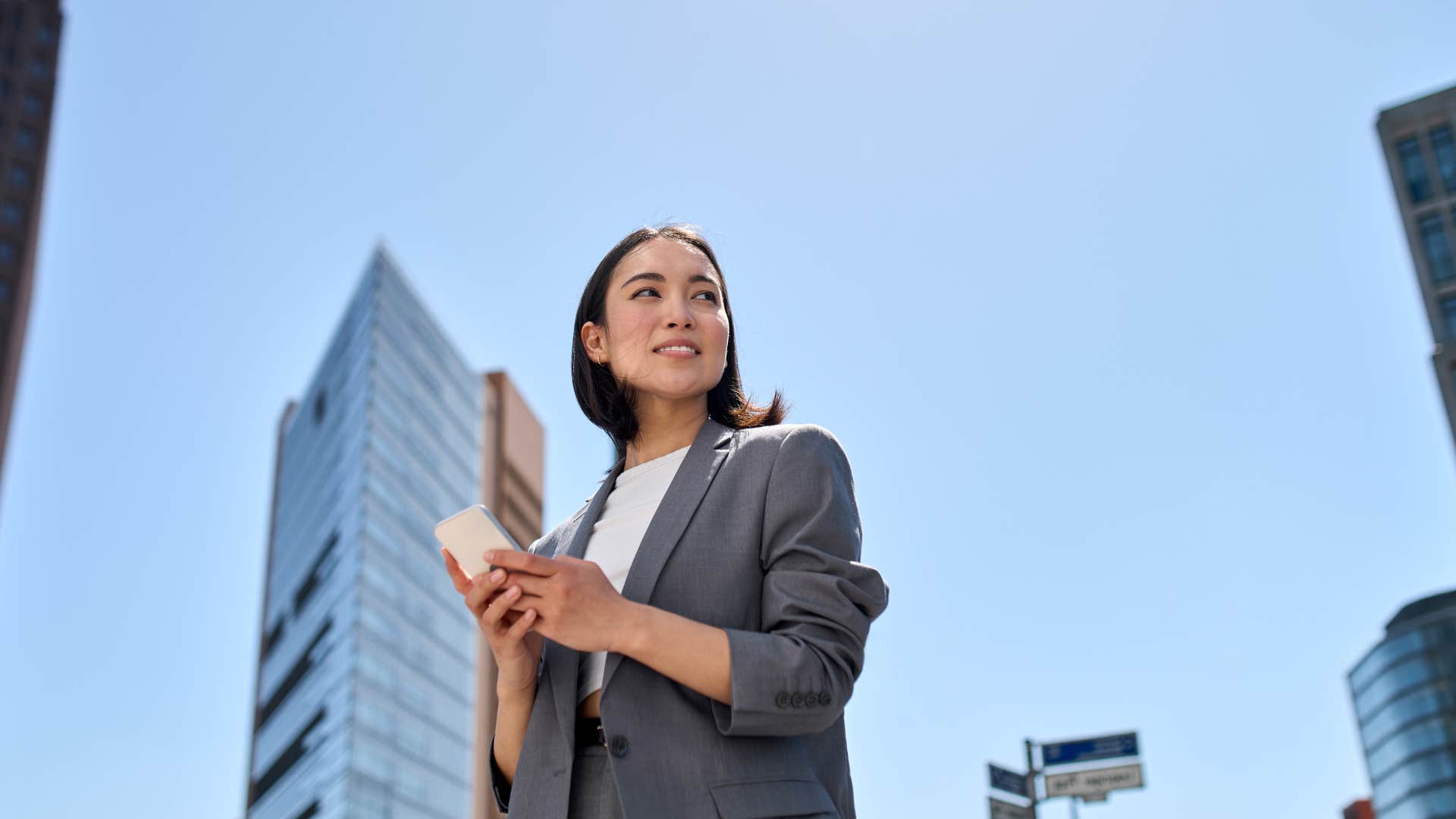 woman who feels happier as she takes break during the workday