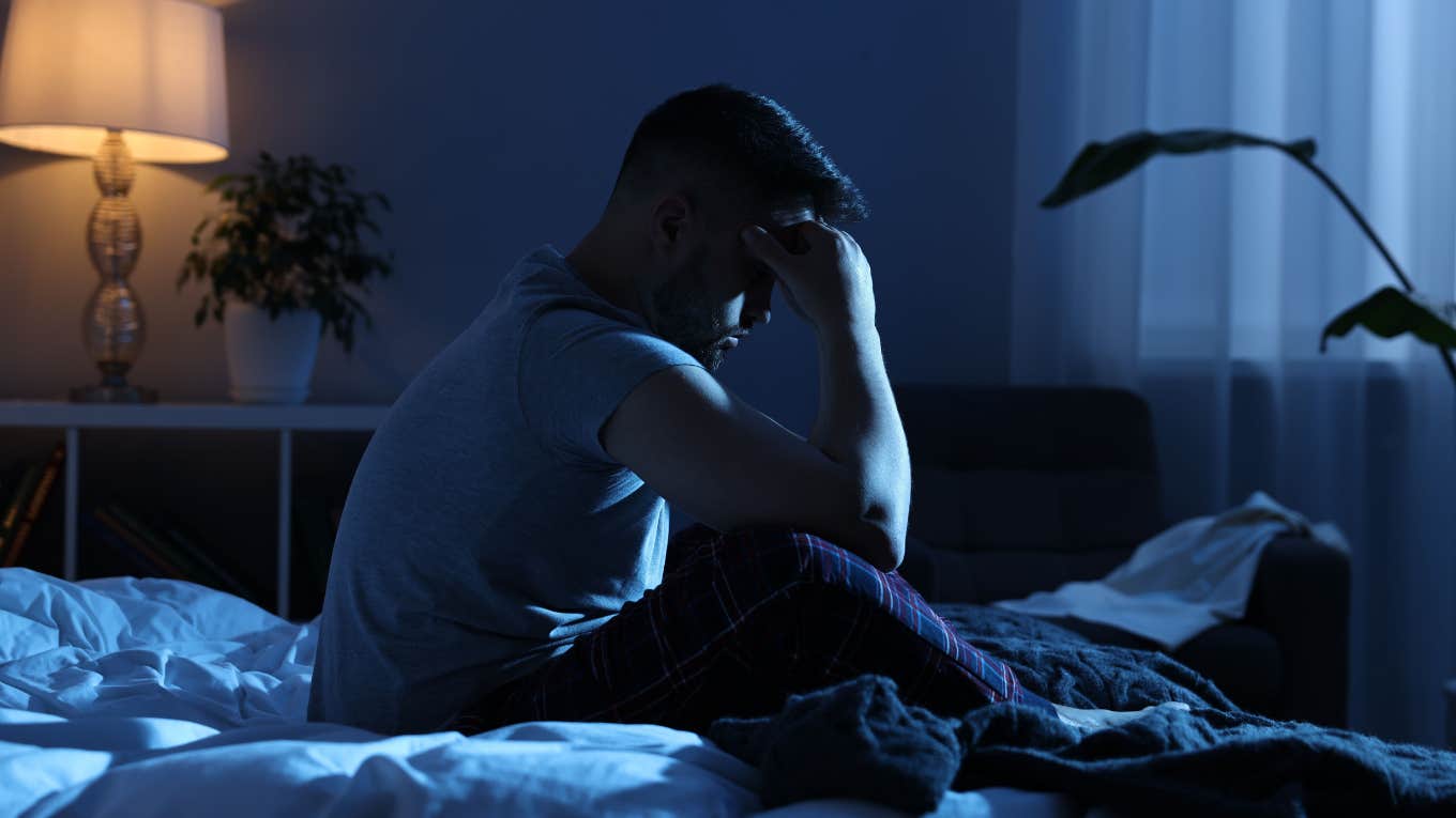 gen z man awake night thinking money problems