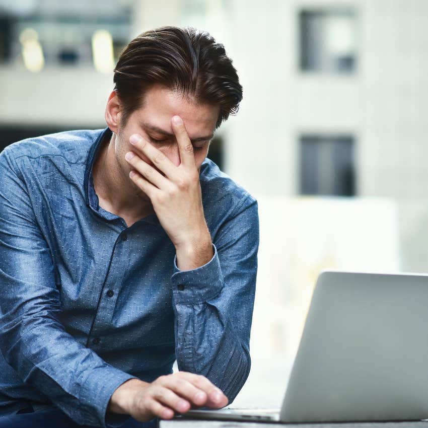 man realizing he's overdrawn after keeping extra money from an ATM