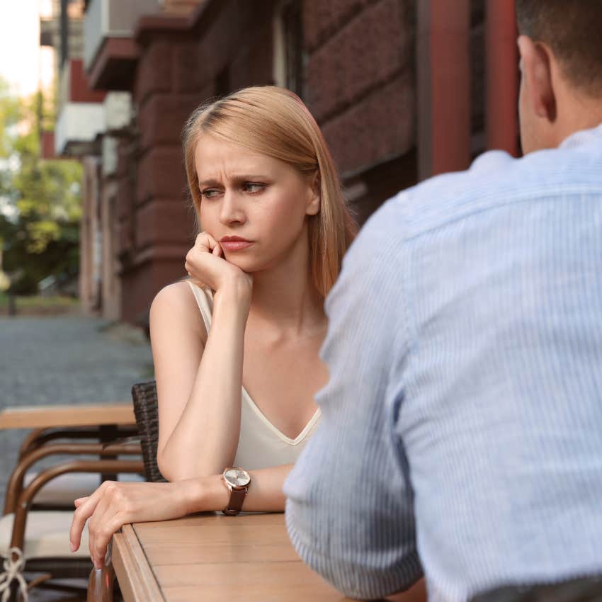 man who is pulling away from woman because of bad experiences with love