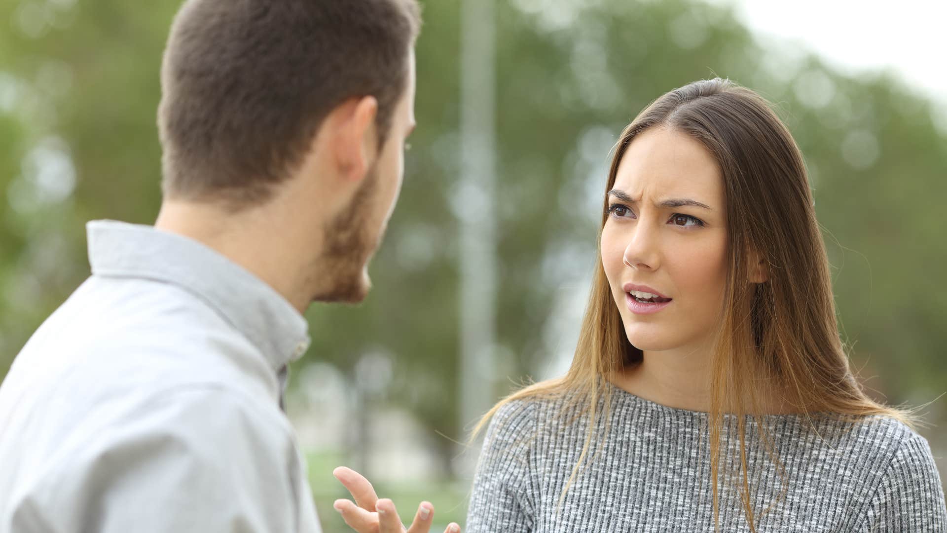 woman talking down to husband in public
