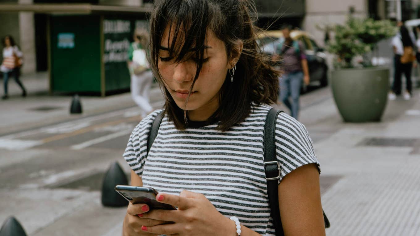 woman using noble mobile company pay you use phone less