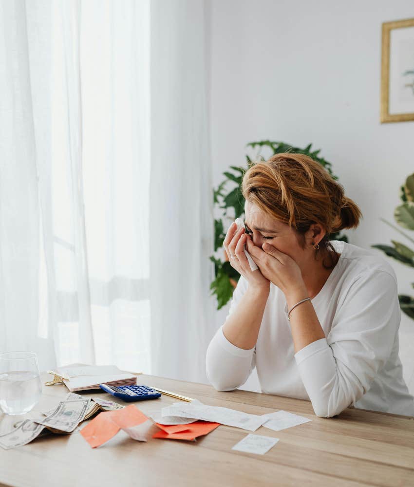 woman sobbing realizing student loan interest rate