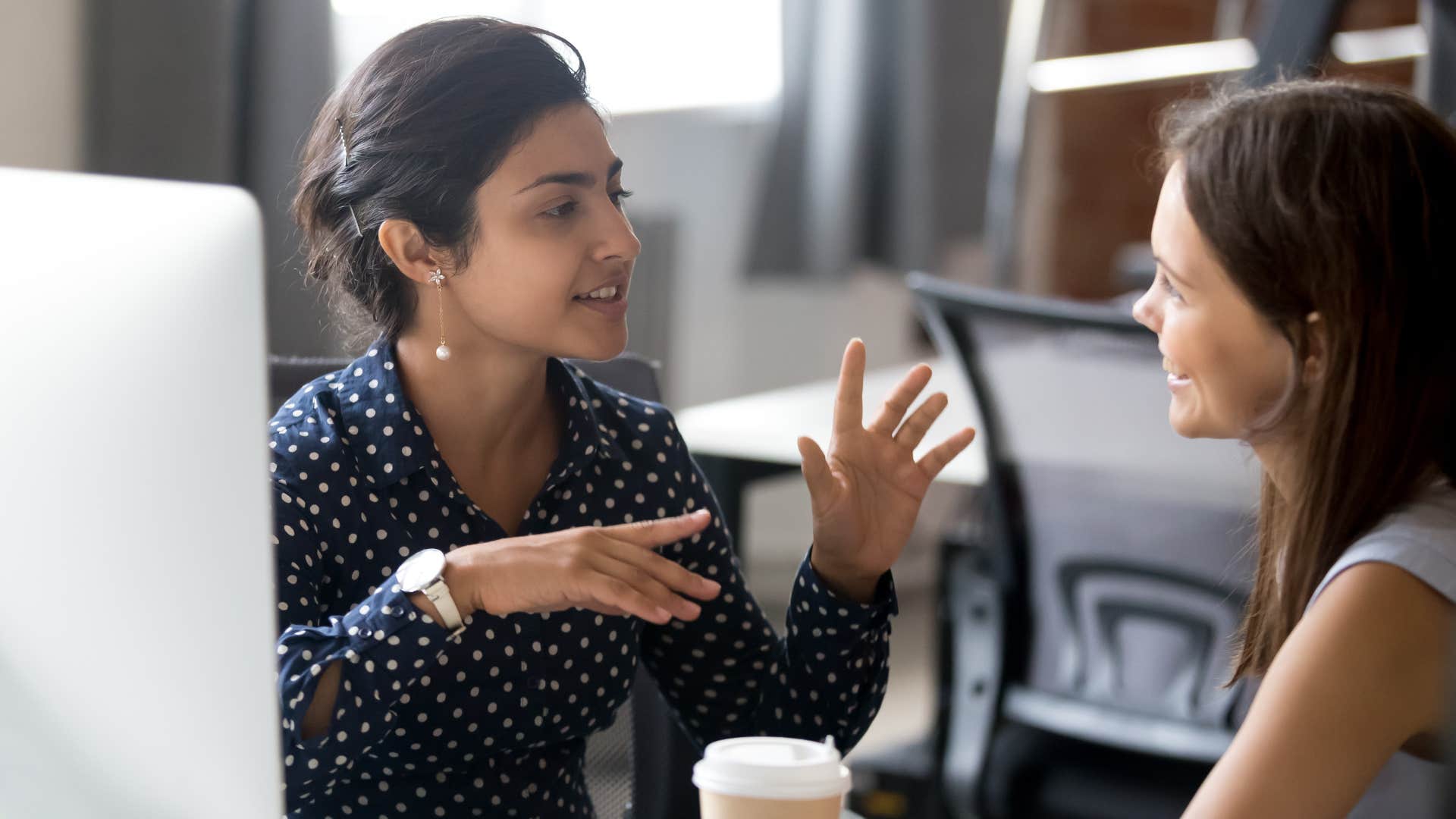 woman deflecting questions from colleague