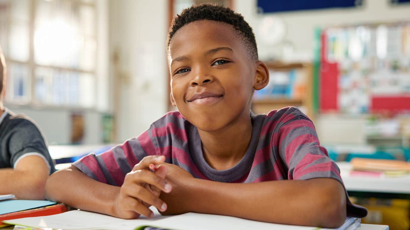 young boy in class learning