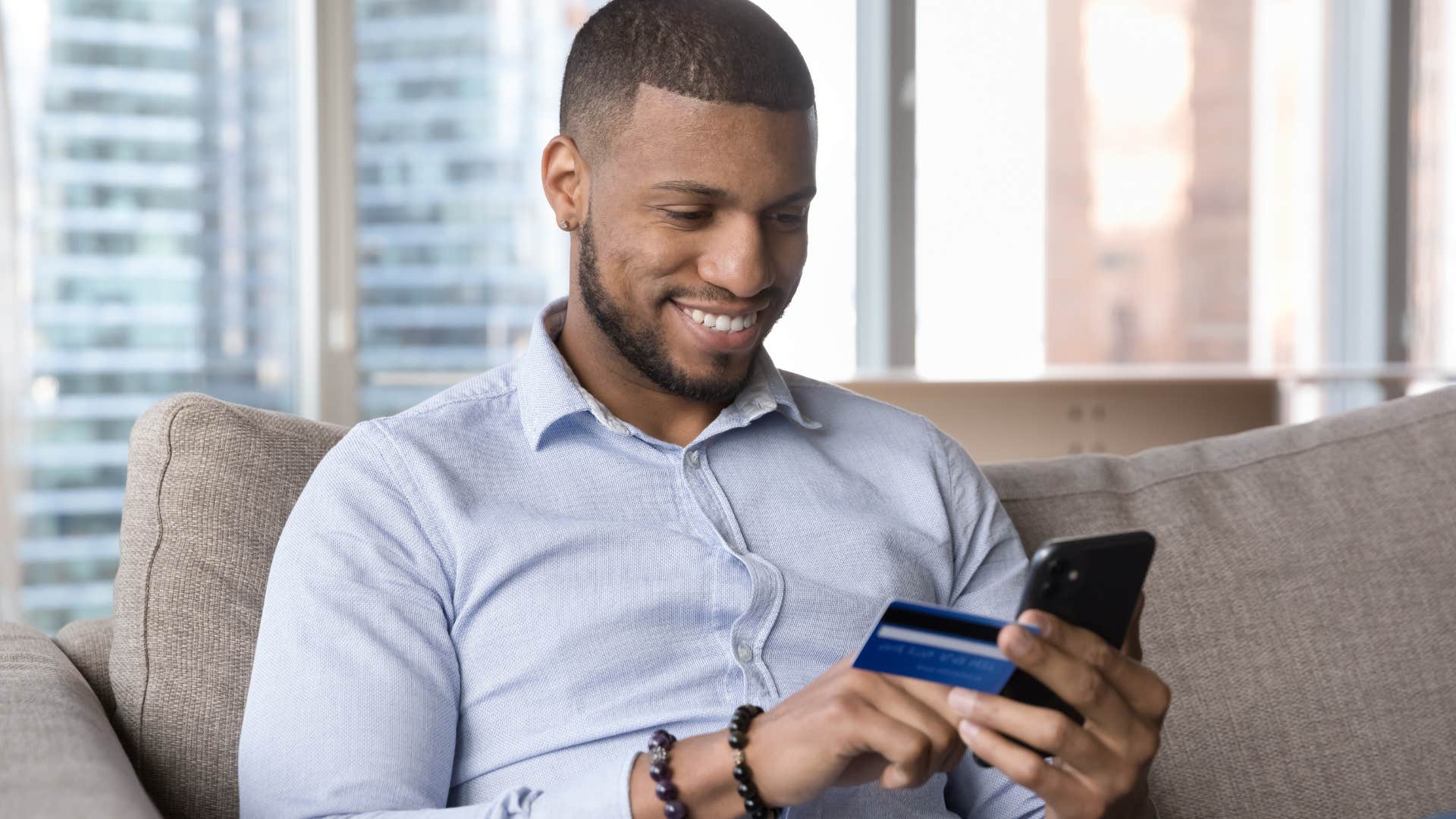 man using budgeting tools on his phone