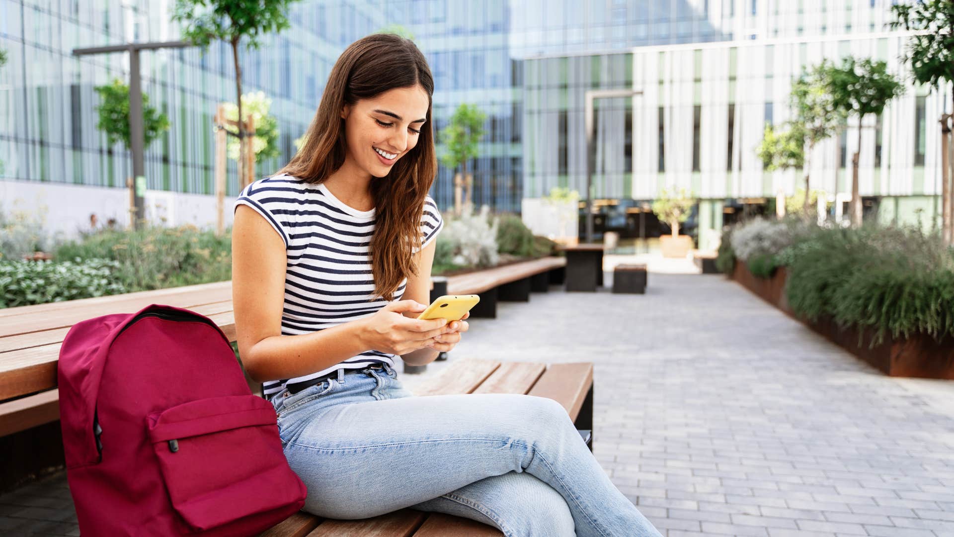 woman using educational apps on her phone