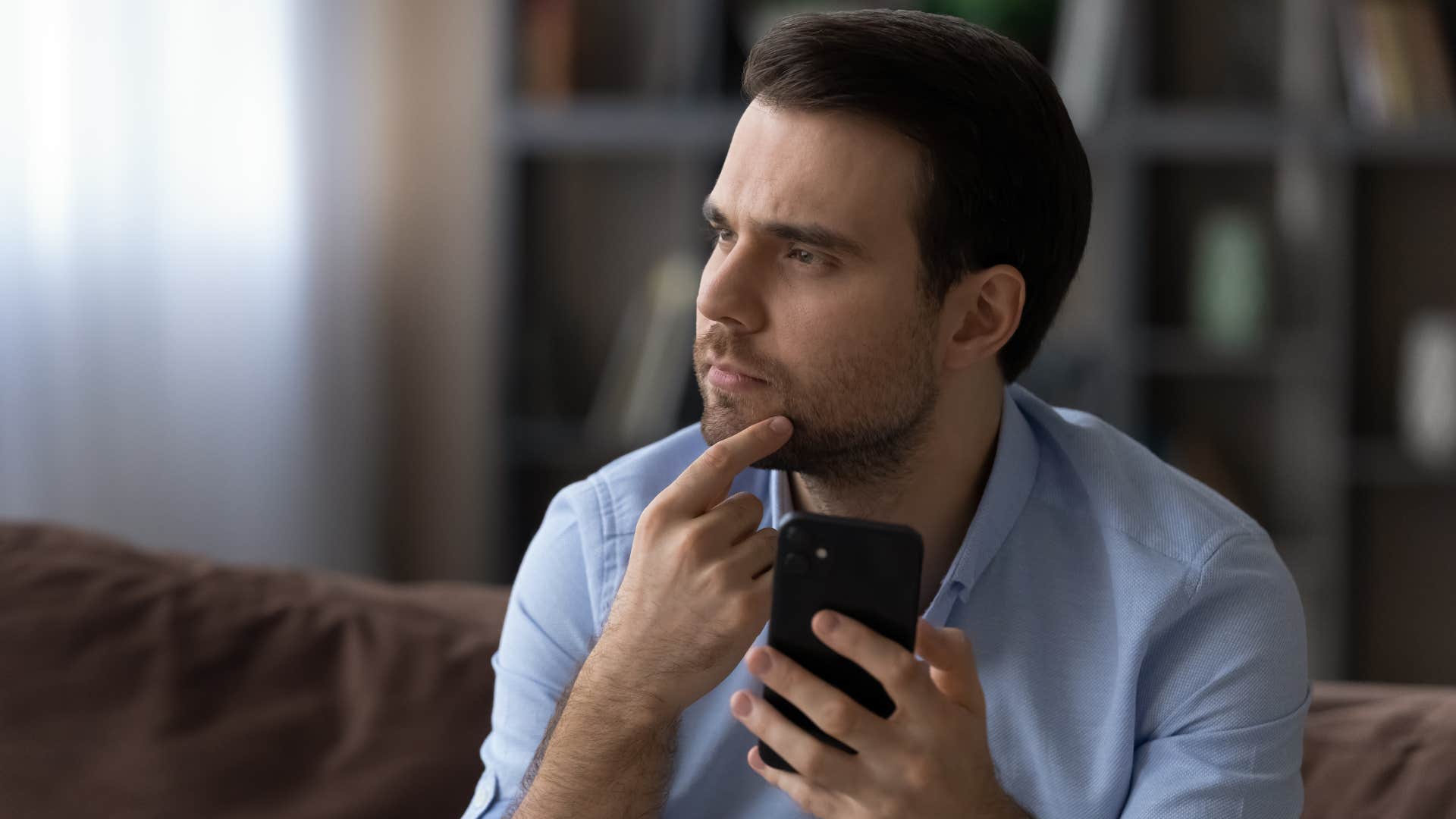 man implementing security features on his phone