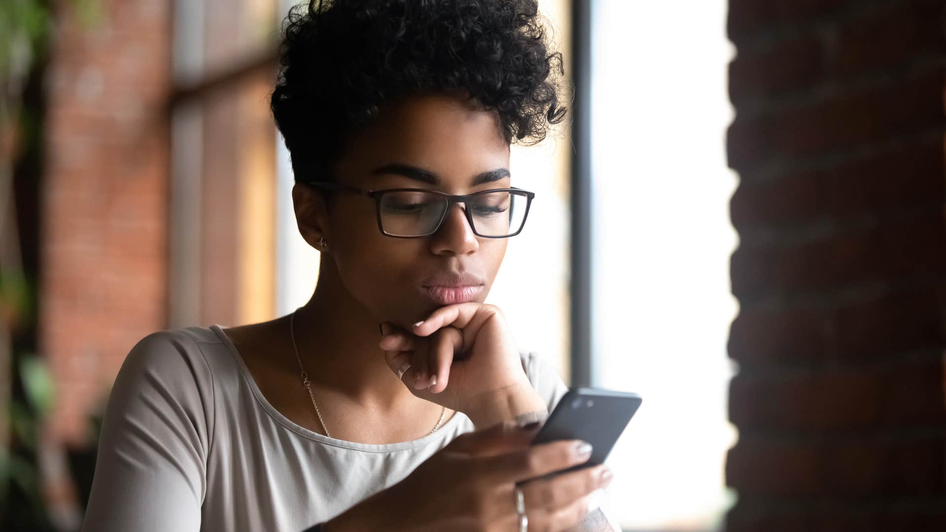 woman taking notes on her phone