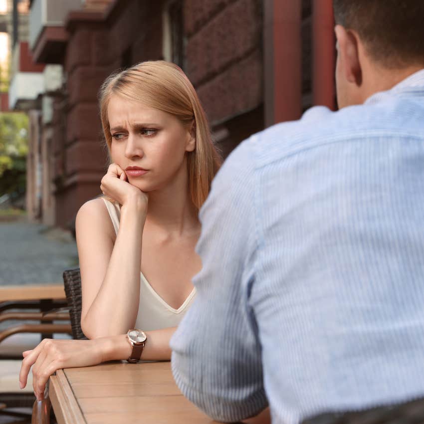 man who is turning woman off acting like someone handed him a mic