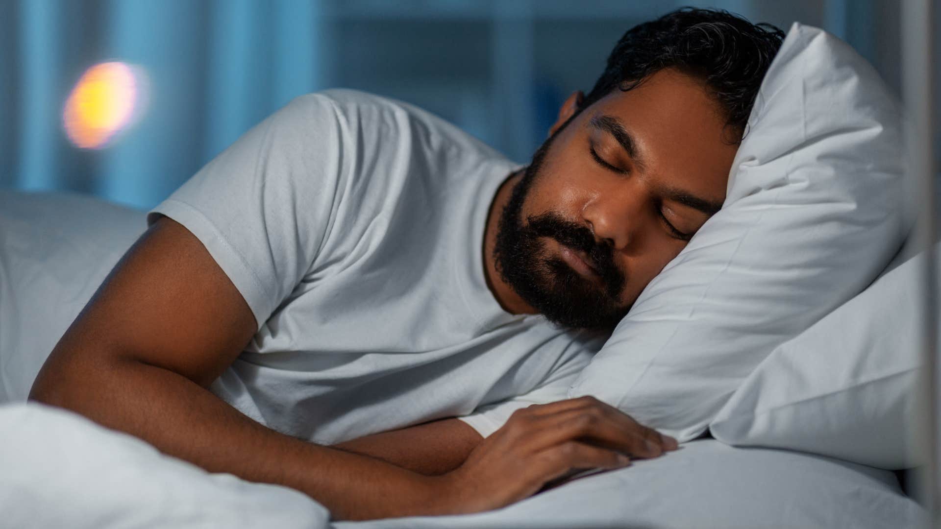 man in bed catching up on sleep