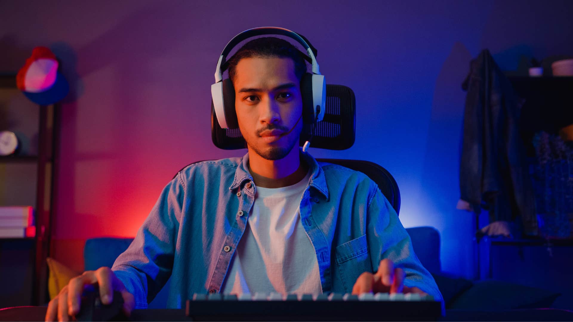 man with headphones gaming as his fulfilling hobby