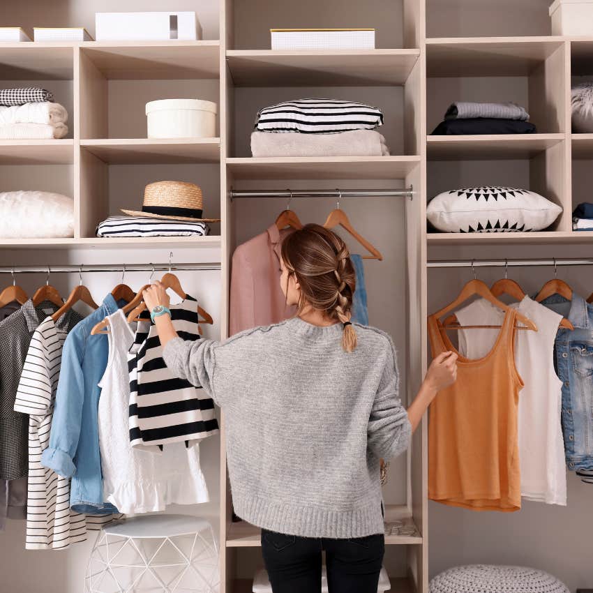 woman with a meticulous home as she organizes her shelves
