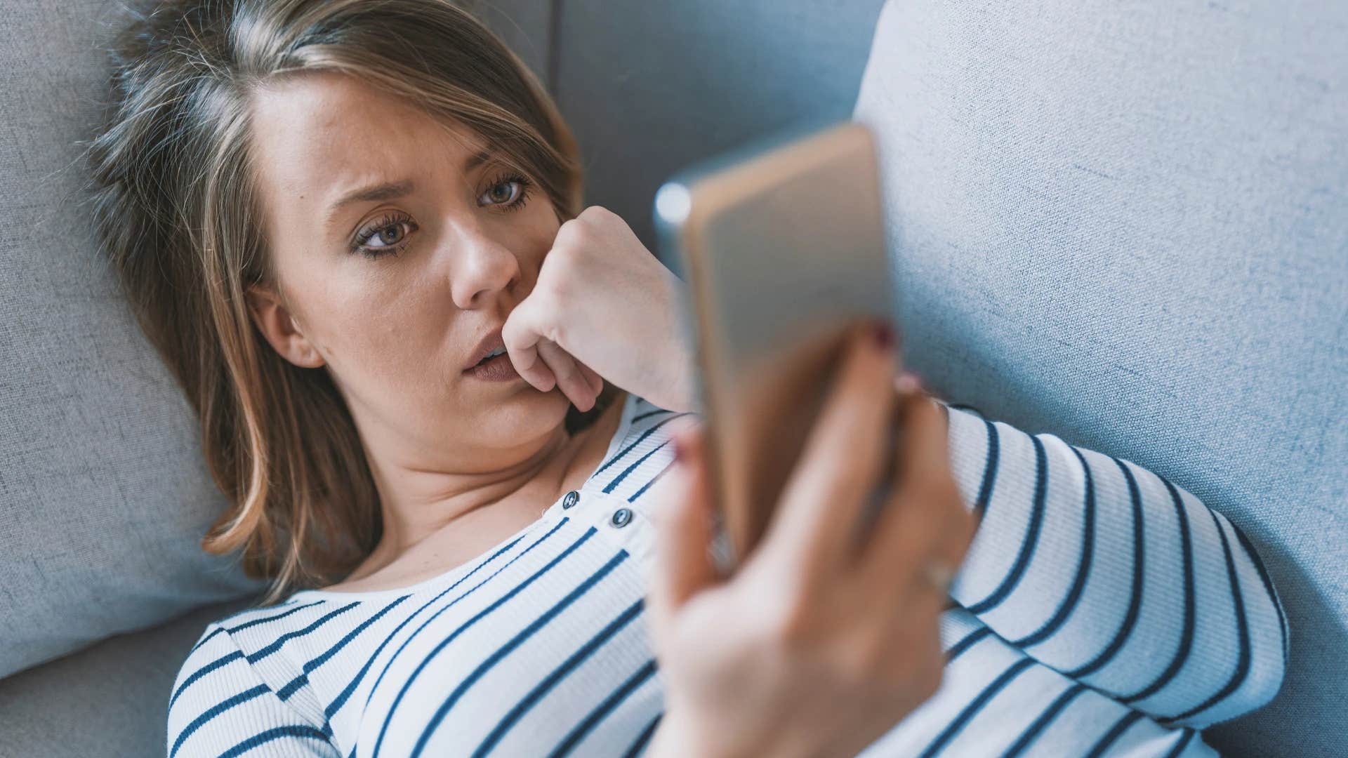 woman completely glued to her phone