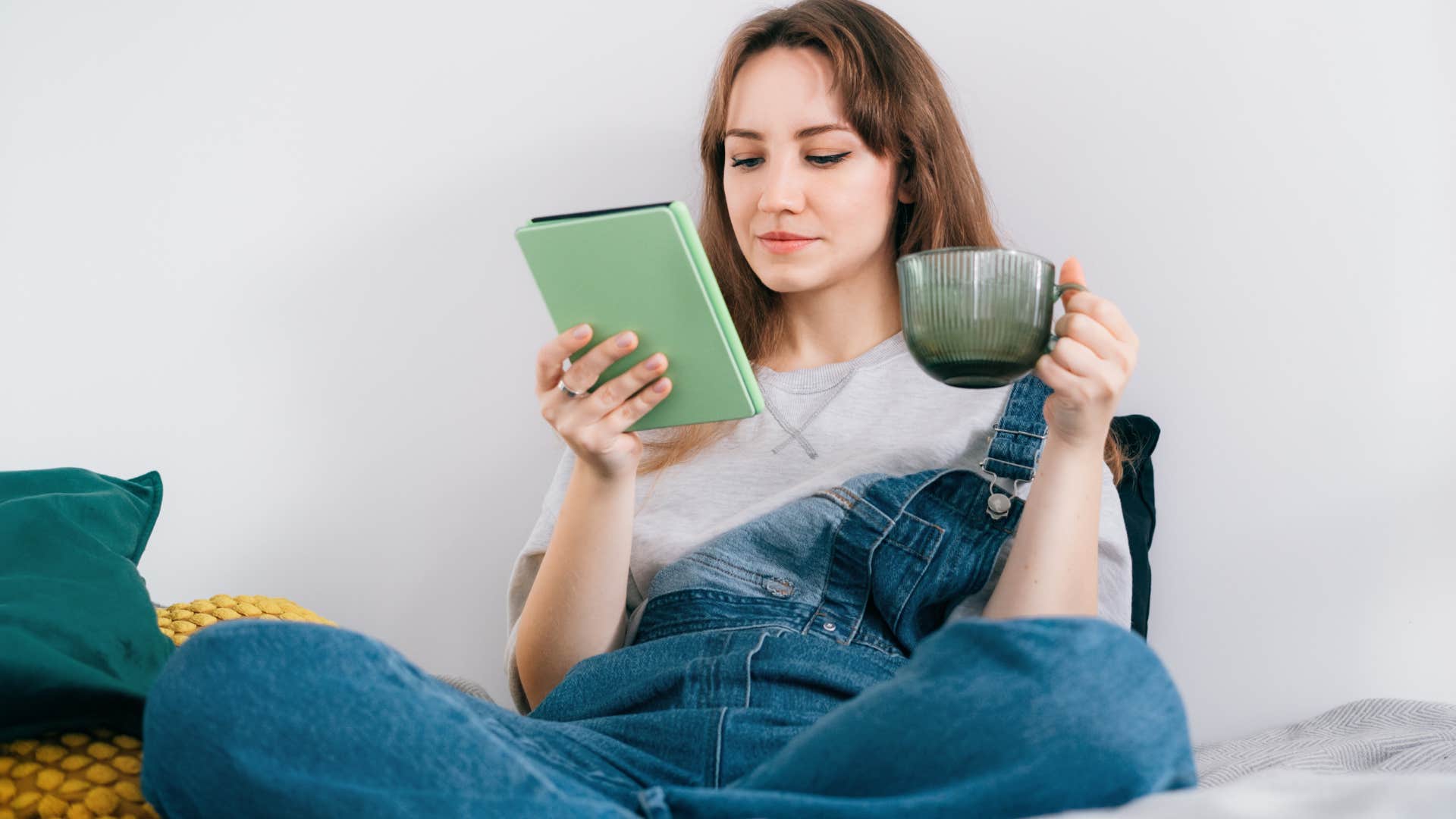 woman who's being overly private sitting at home