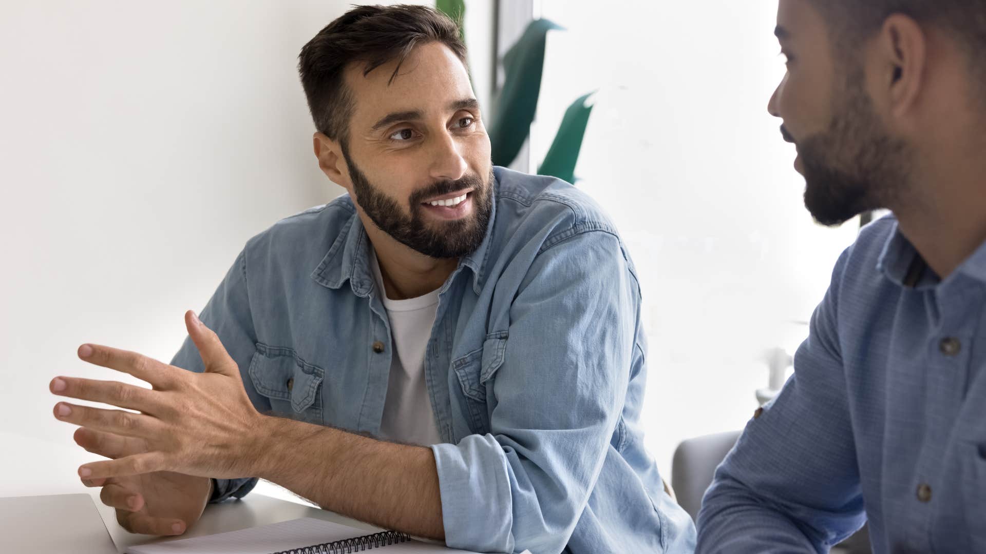 man being overly sarcastic while talking to his friend