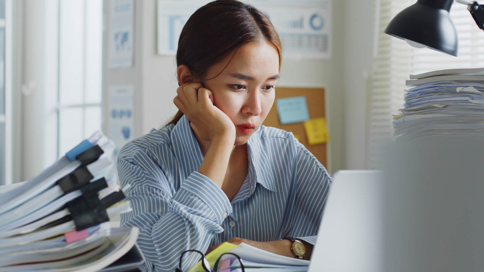 woman thriving under pressure working in an office