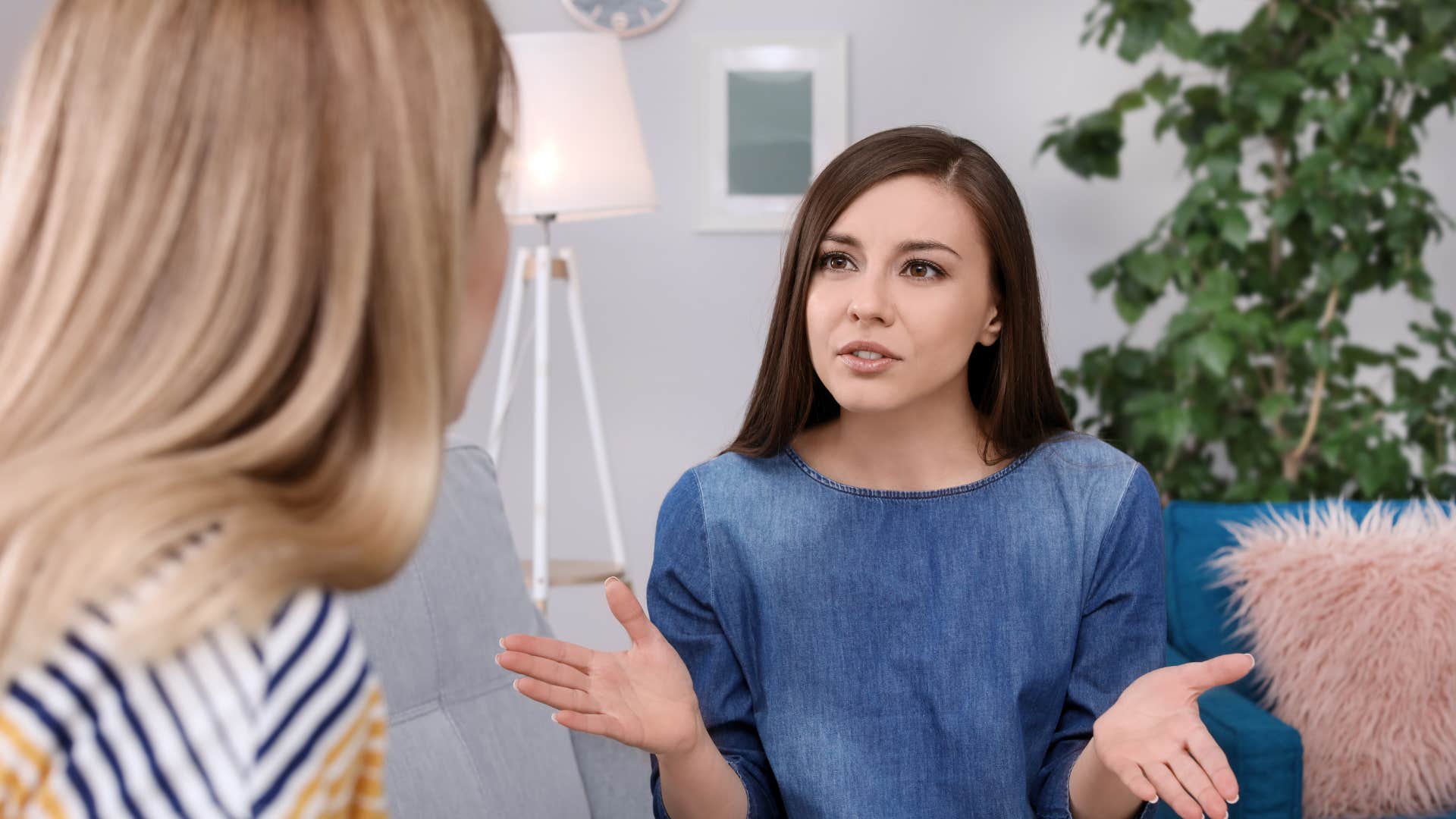 friend in denim dress saying you owe me to friend