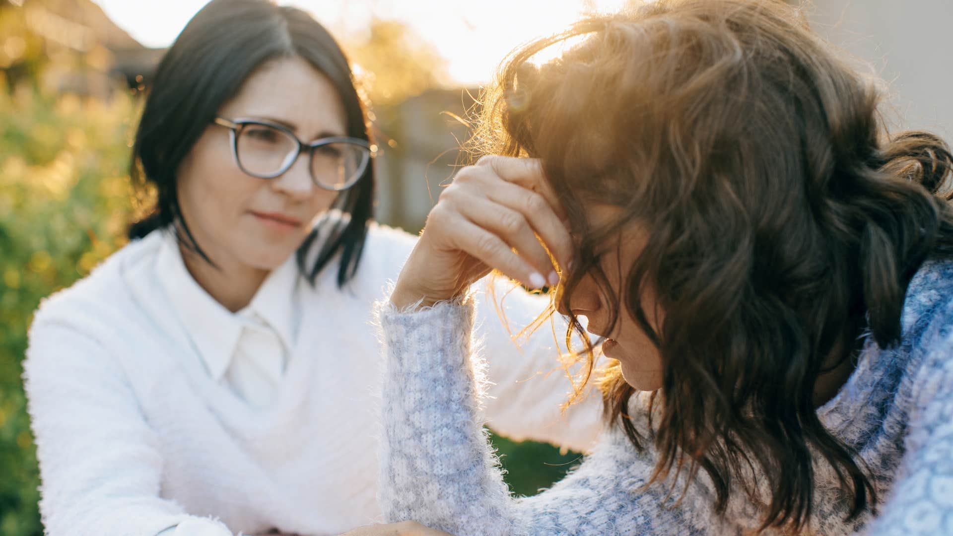 Upset woman saying "I've stopped caring about fixing things" to a friend.