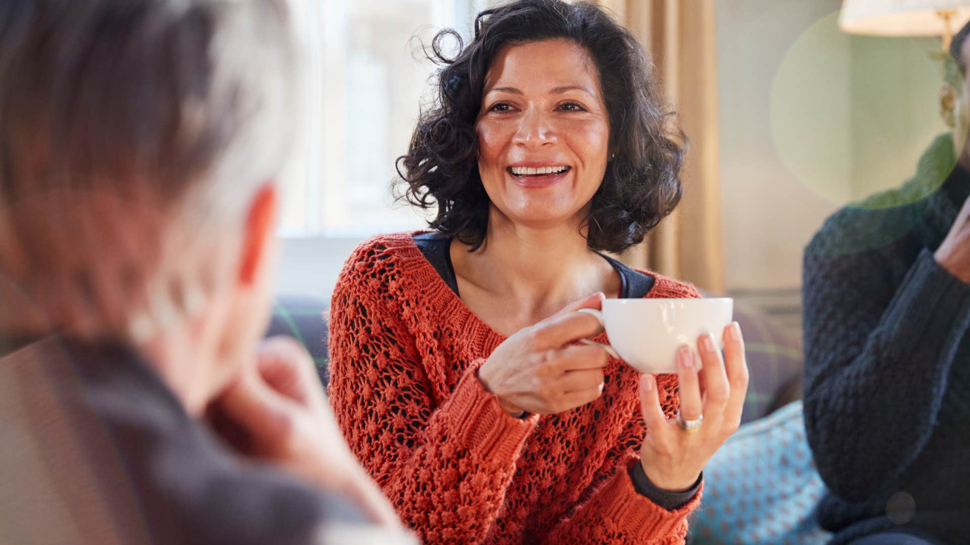 woman sitting around people who dont remember her name