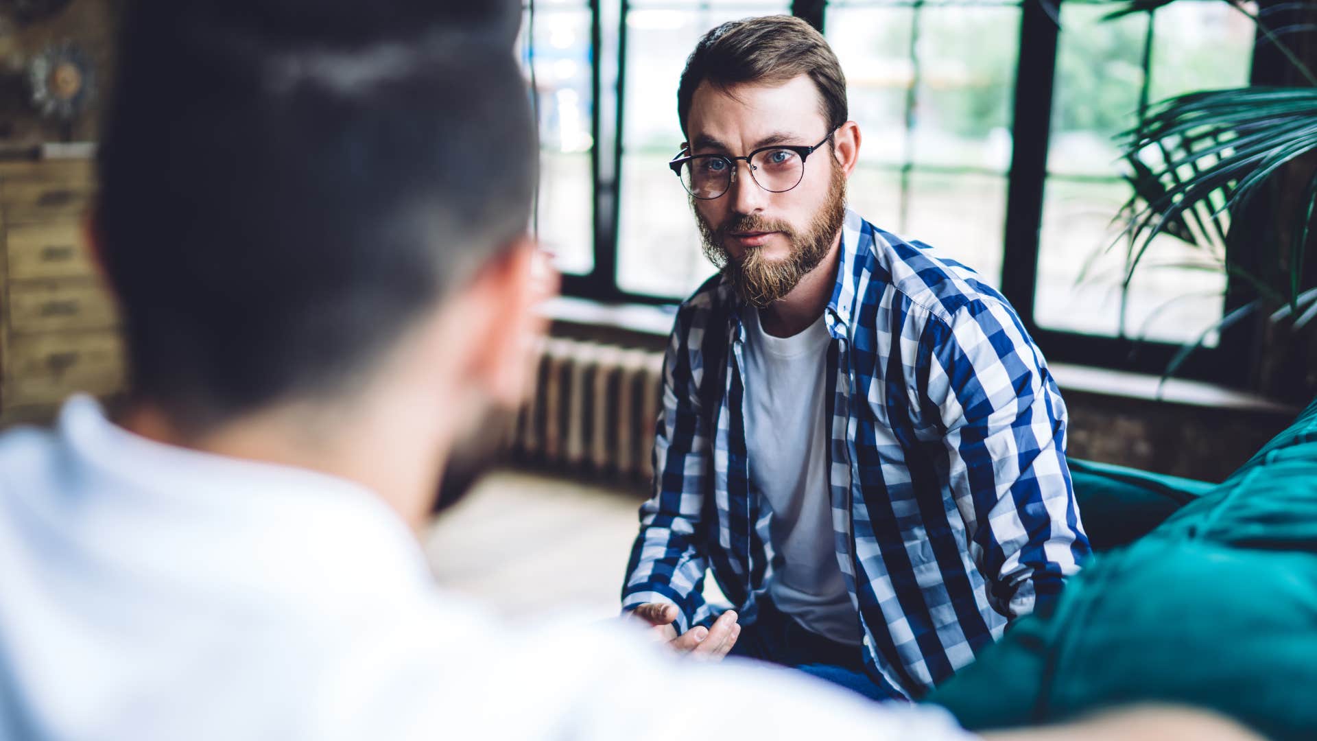 man noticing friend's tone of voice in a conversation