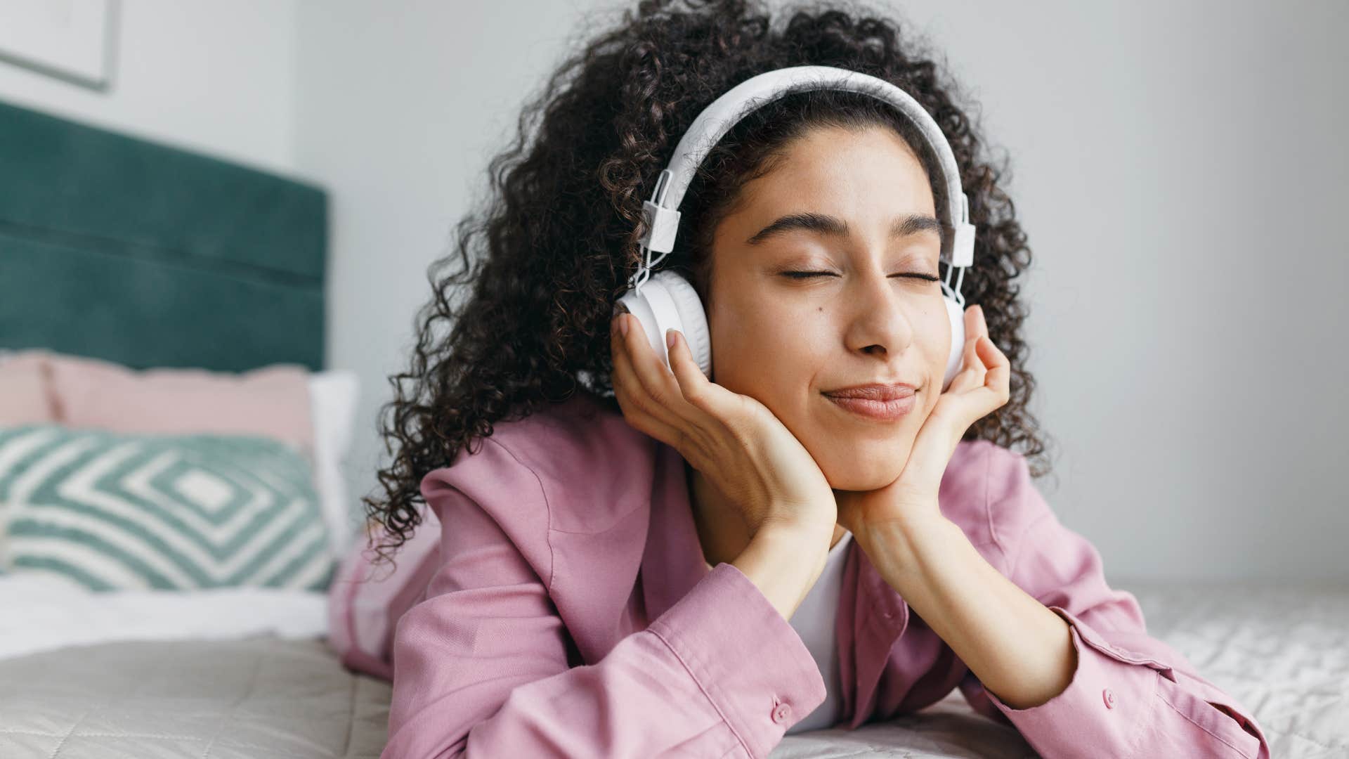 creative woman listening to music at home