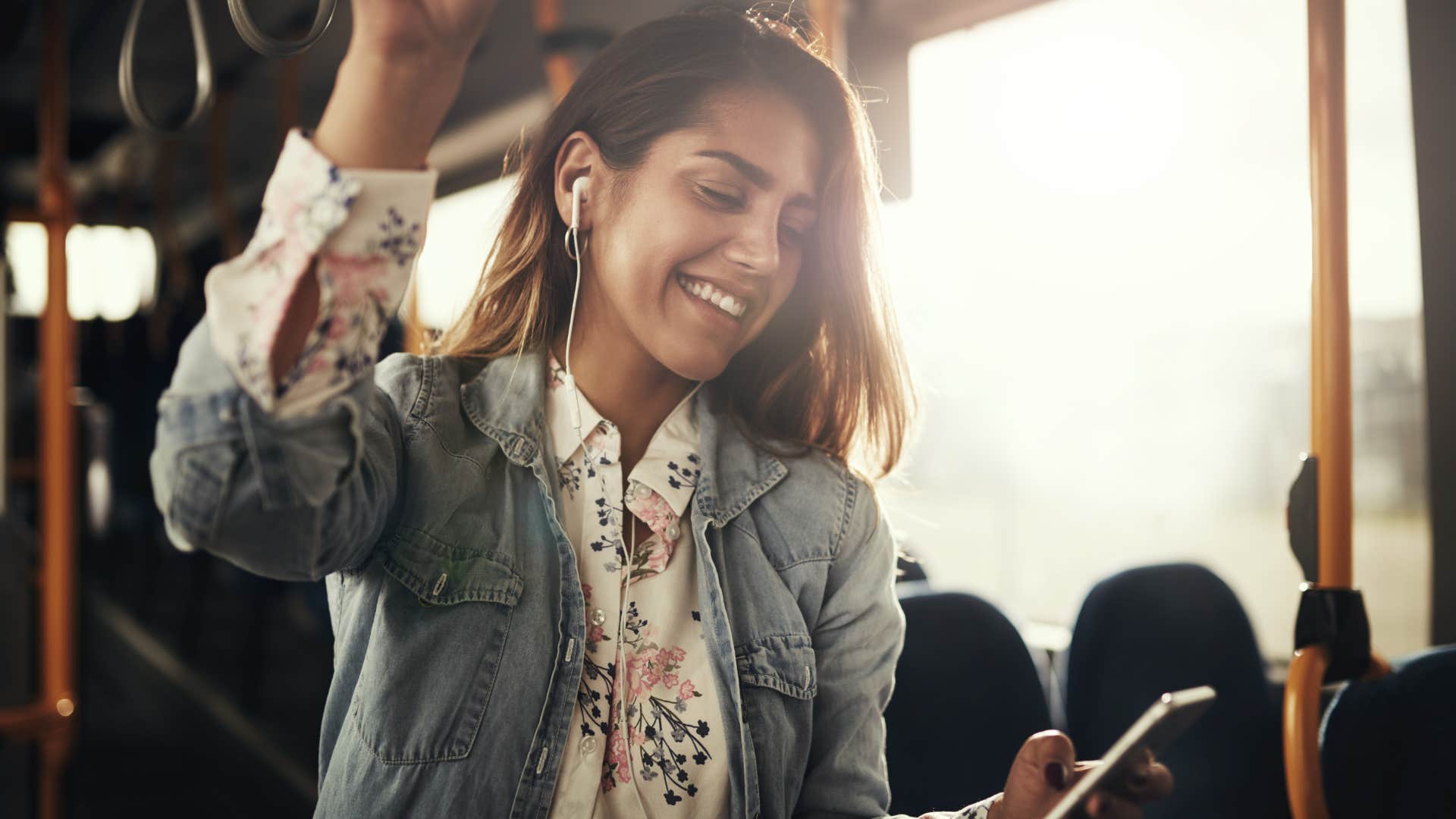 woman with deep empathy listening to music on a bus