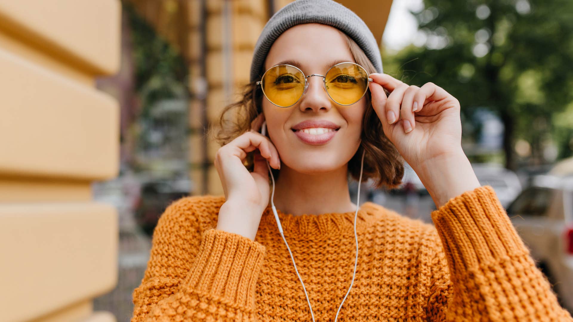intuitive woman with earbuds in