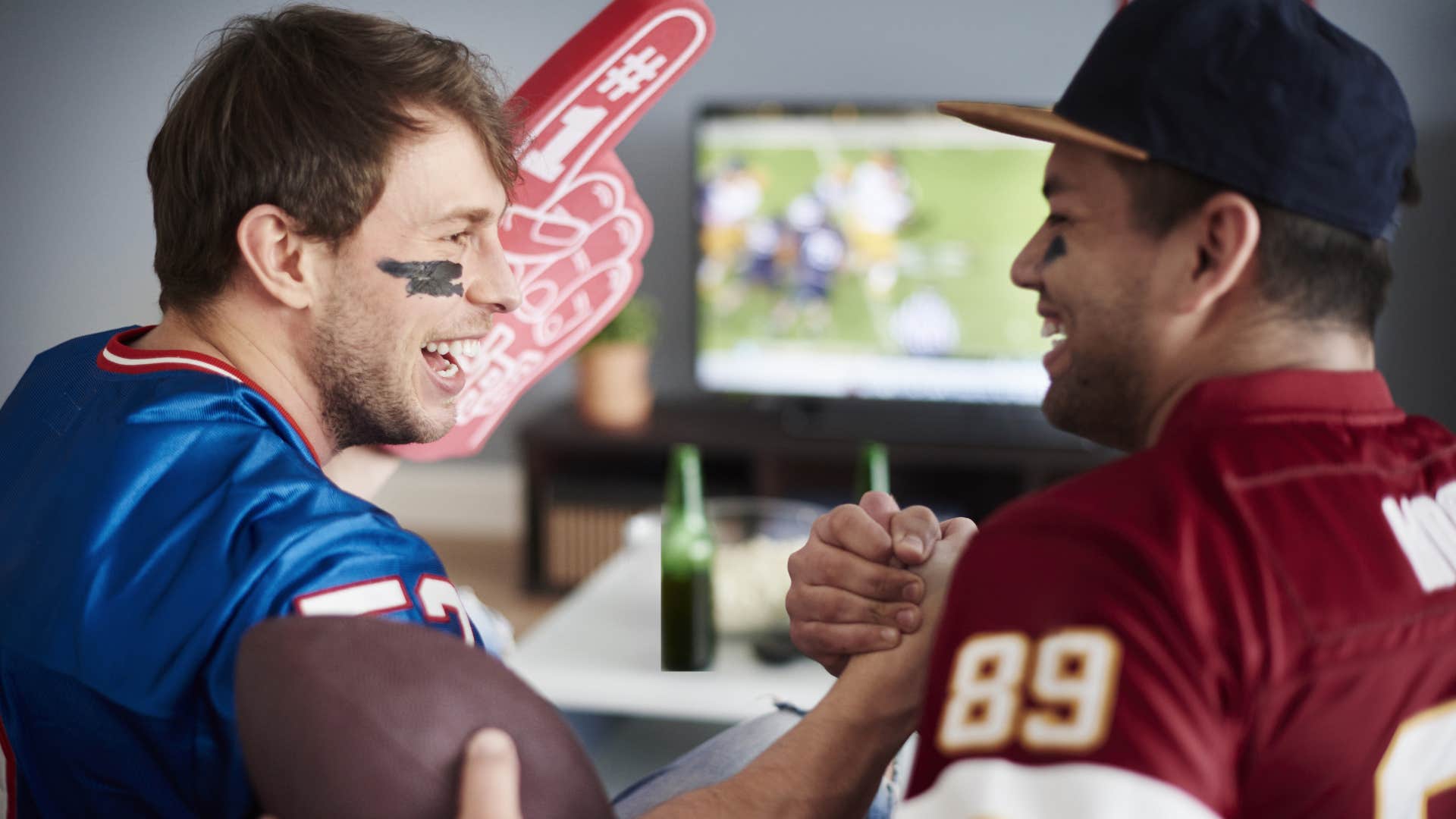 men watching TV with college football 