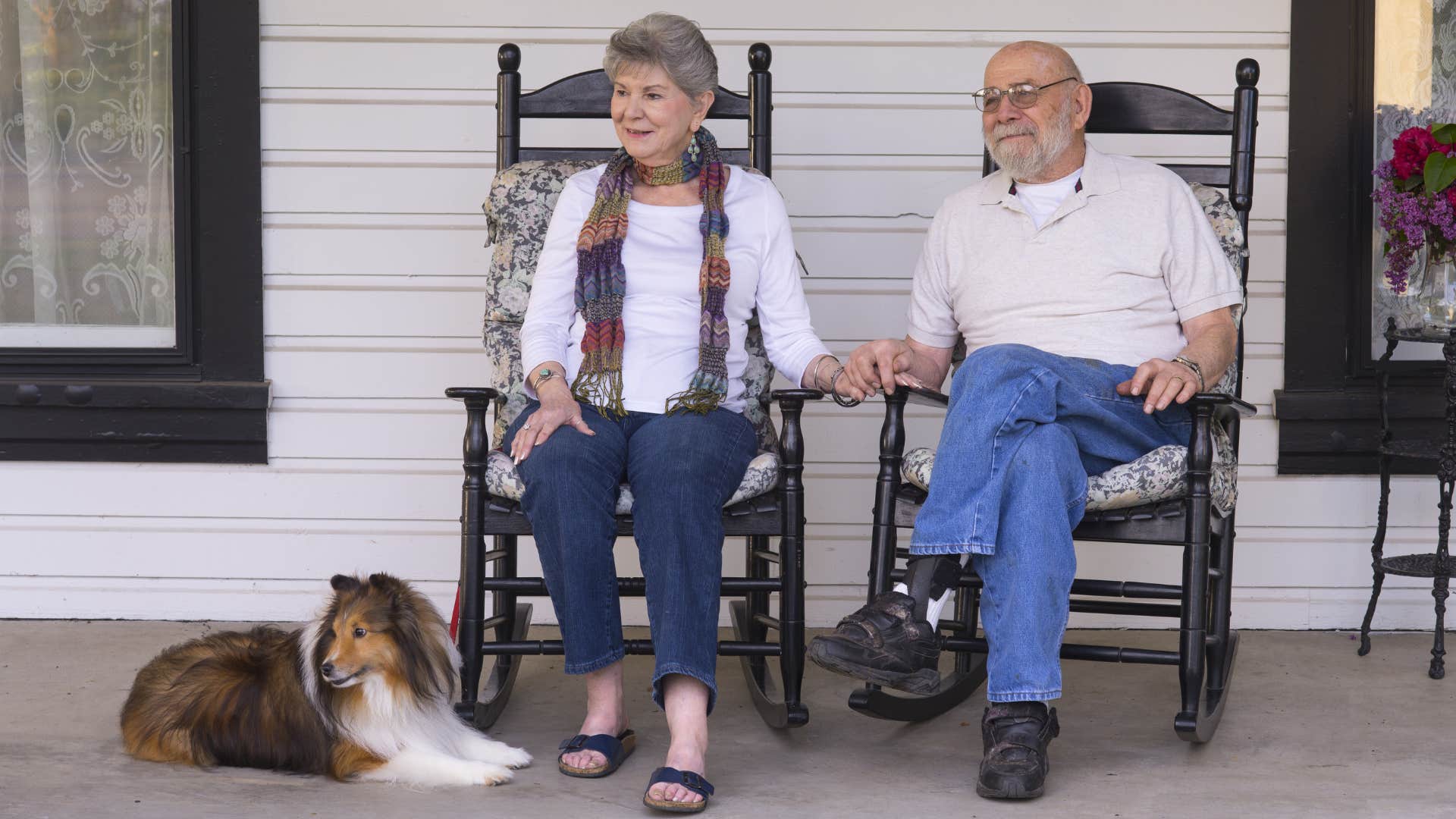older couple sitting on their porch