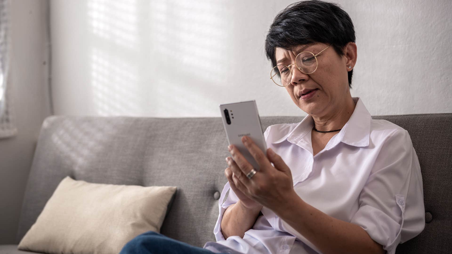 older woman annoyed by comparison culture on social media
