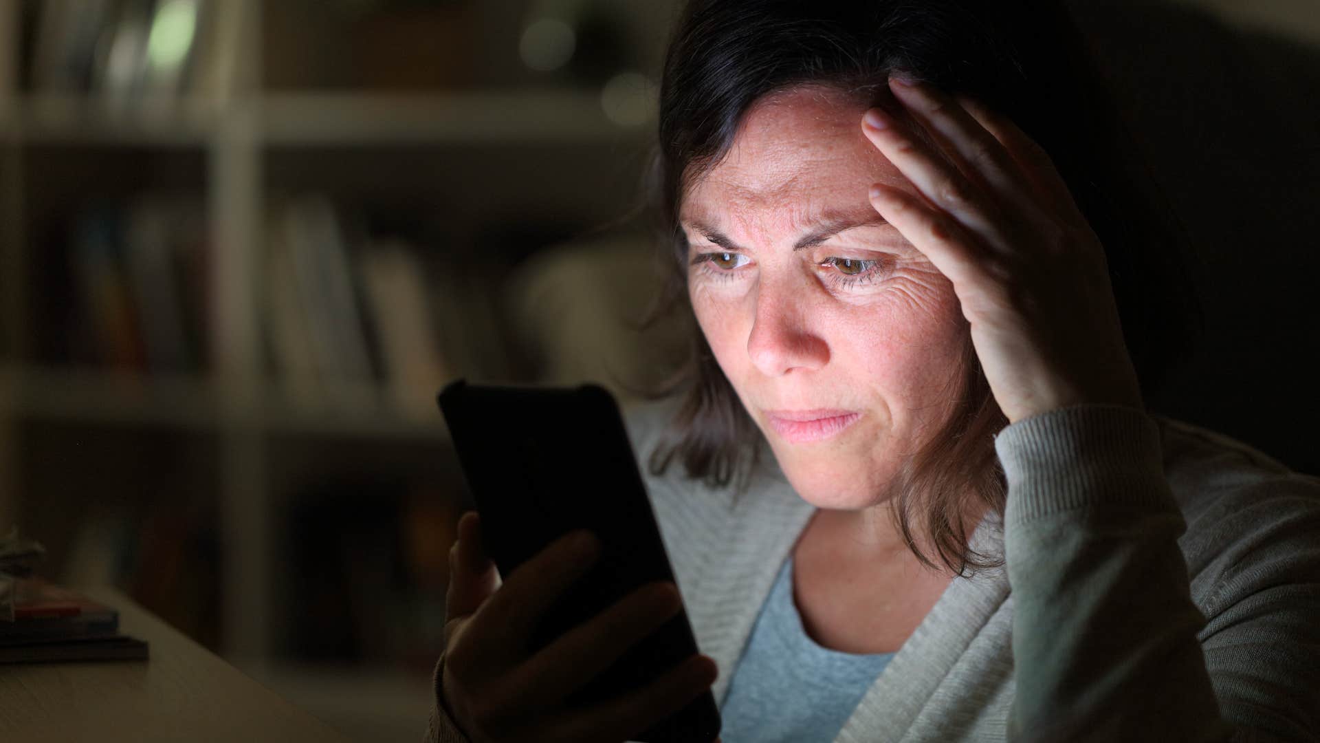 woman looking at controversies on social media