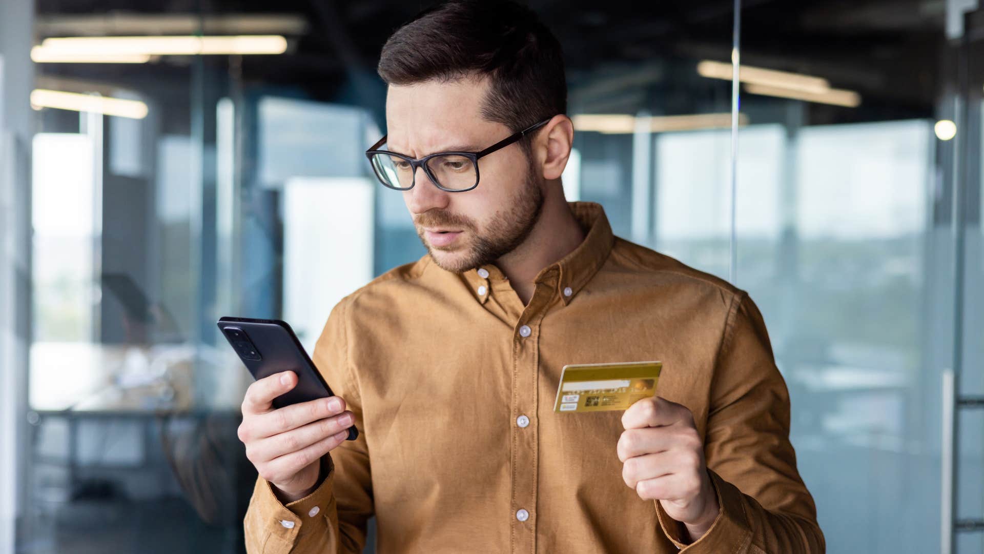 man facing pressures to spend money on his phone