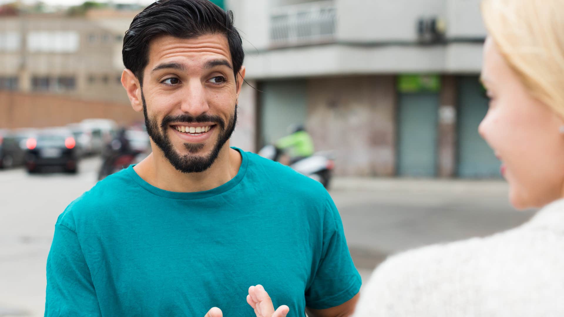 woman talking to a man assuming he has good intentions