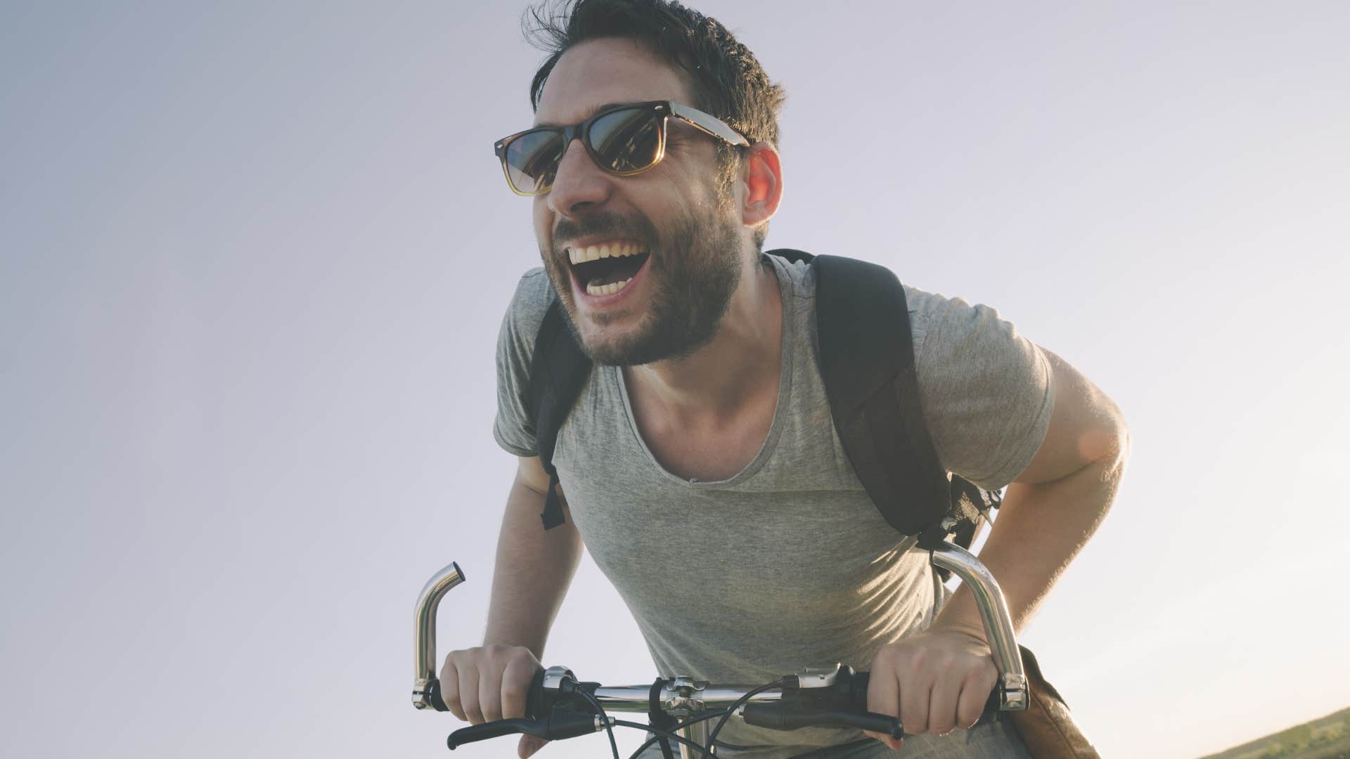 man who lacks street smarts riding a bike without a helmet on