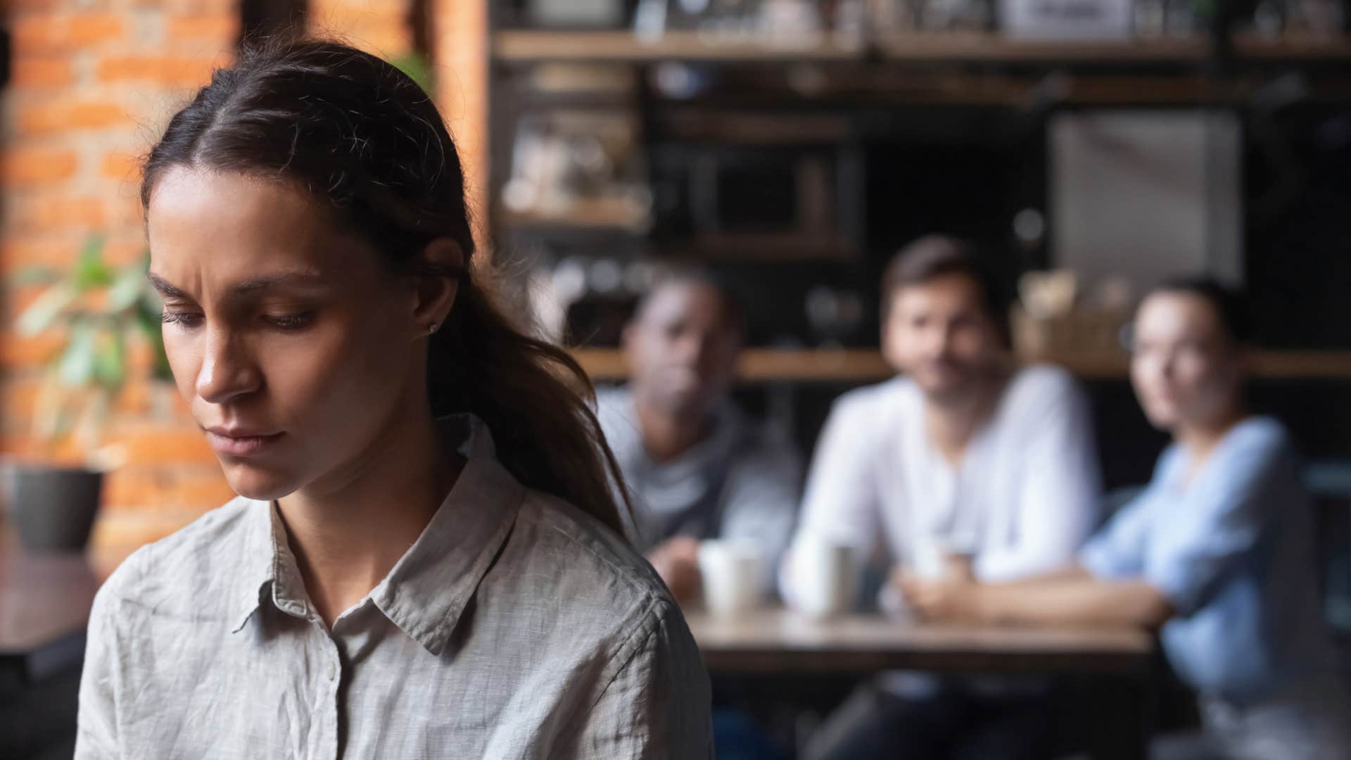 kind woman avoiding conflict with friends turning her back on them